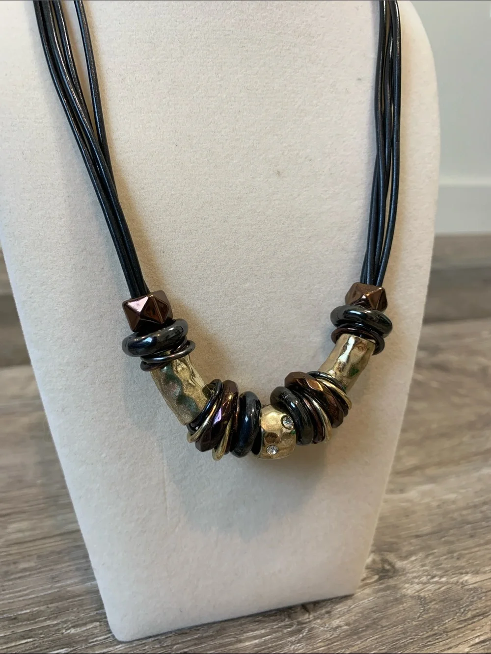 Multi-Strand Black Cord Necklace with Metallic and Brown Accents